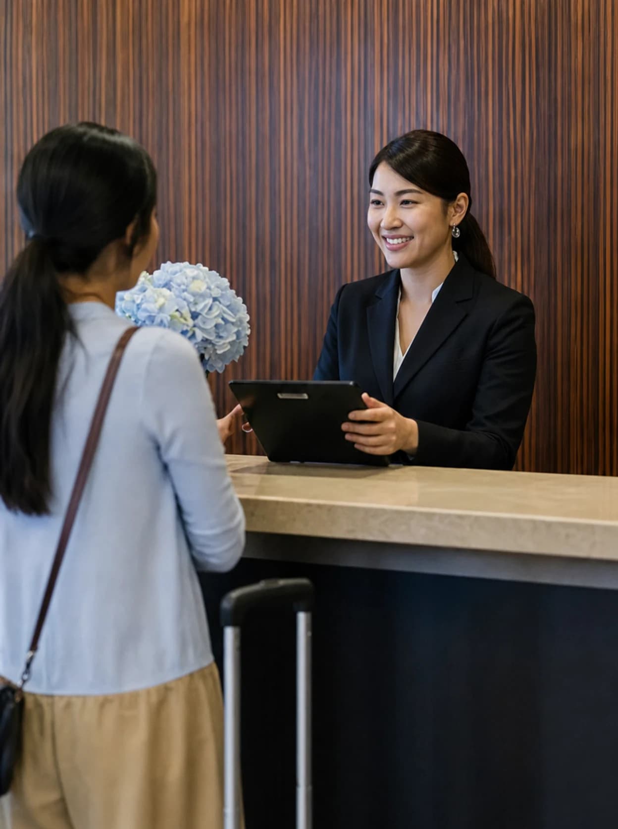 Hotel guest services specialist welcoming a guest